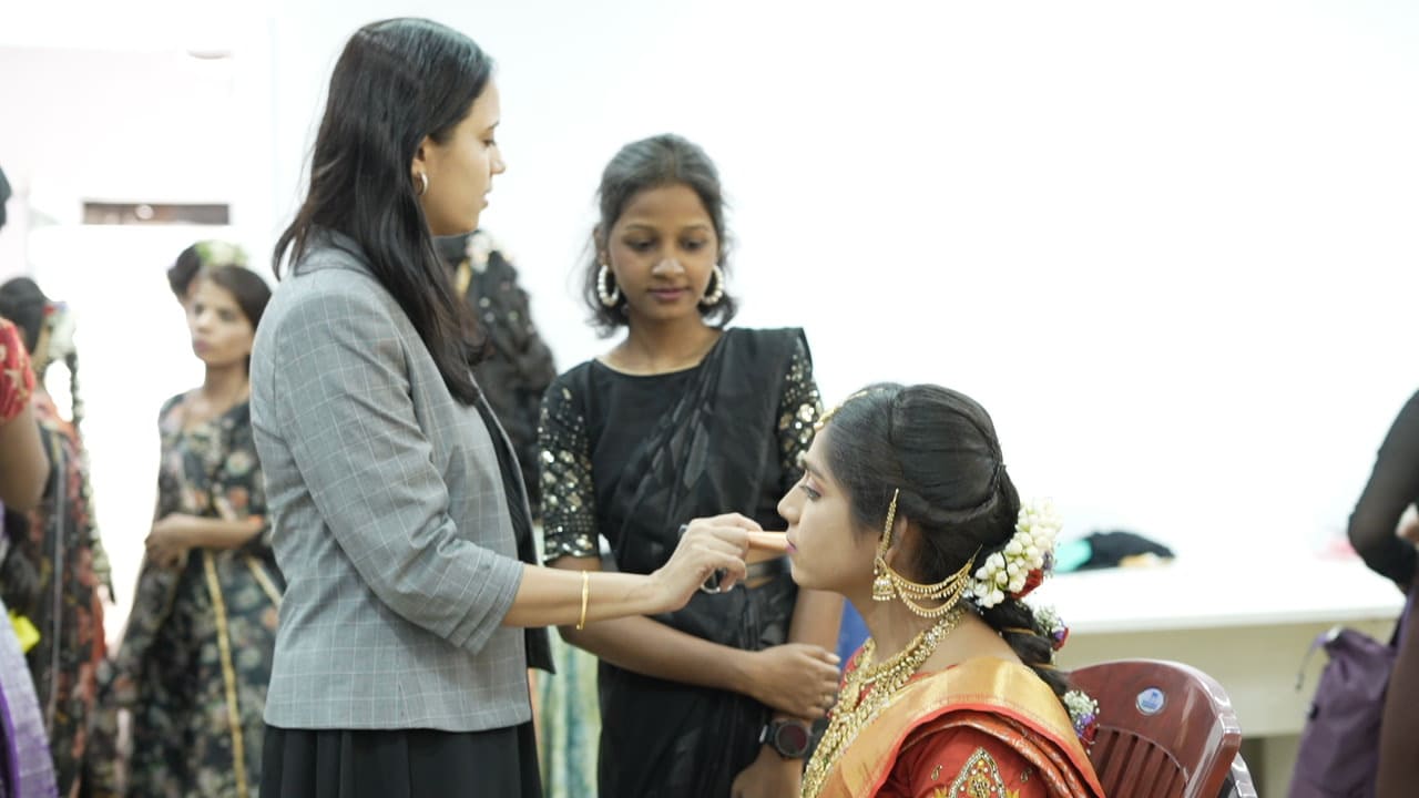 Students practicing bridal look at a beautician academy in Hyderabad